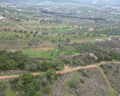 FOÇA KOCAMEHMETLERDE ETRAFI TEL ÇEVRİLİ SATILIK ARAZİ